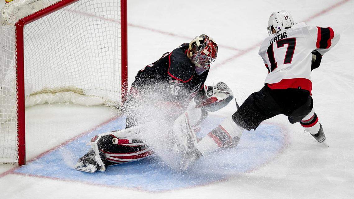 Carolina Hurricanes’ goalie Antii Raanta (32) stops a scoring attempt by Ottawa’s Ridly Greig (17) during the second period on Tuesday, April 4, 2023 at PNC Arena in Raleigh, N.C.