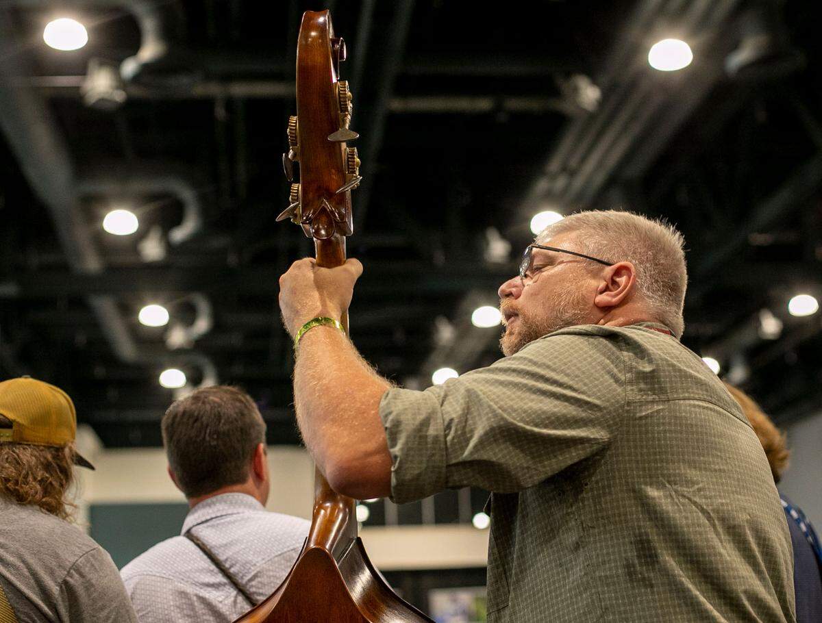 Bass player Todd Kirchner and members of Full Cord Bluegrass from Grand Haven, Michigan perform on Thursday, September 29, 2021 at the Raleigh Convention Center in Raleigh, N
