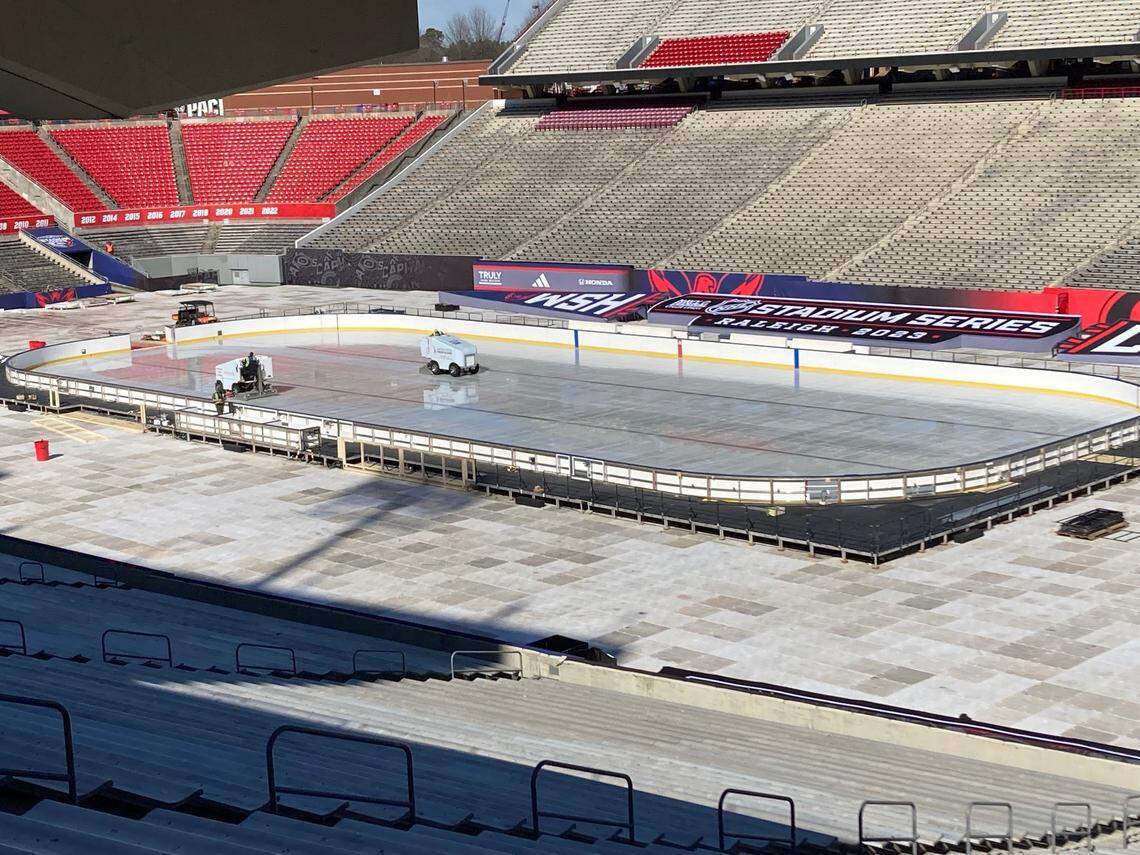 NHL crews work on the ice rink at NC State’s Carter-Finley Stadium for the 2023 Stadium Series outdoor hockey game on Feb. 18 between the Carolina Hurricanes and Washington Capitals.