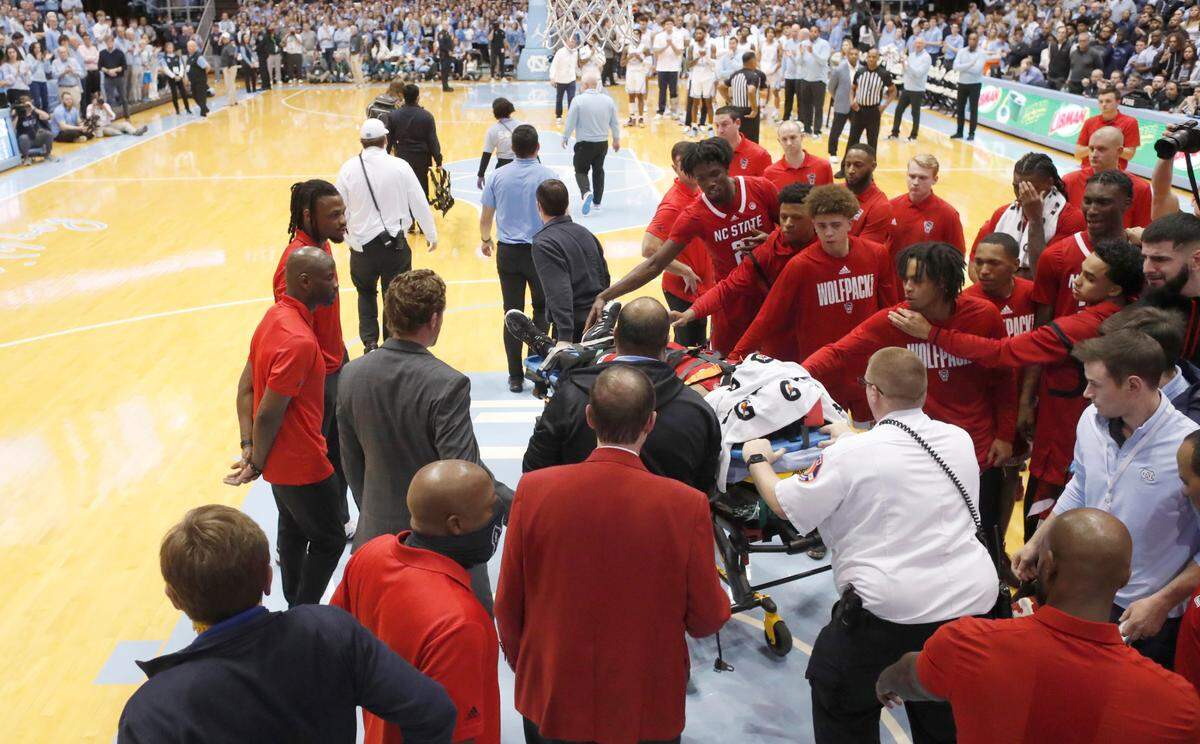 N.C. State’s Terquavion Smith is taken off the floor on a stretcher after he was injured in the second half during UNC’s 80-69 victory over N.C. State at the Smith Center in Chapel Hill, N.C., Saturday, Jan. 21, 2023.