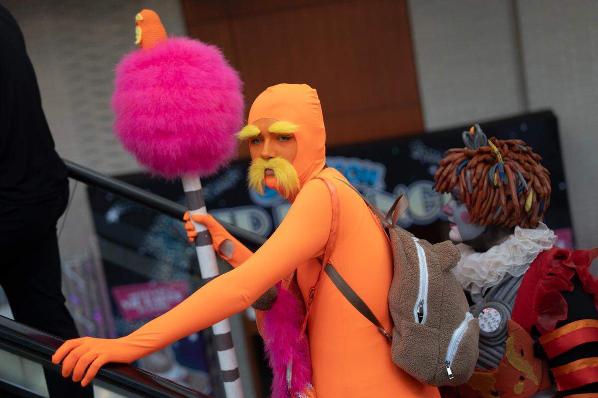Reese Callahan rides the escalator at Galaxycon at the Raleigh, N.C. Convention Center on Friday, July 25, 2025.