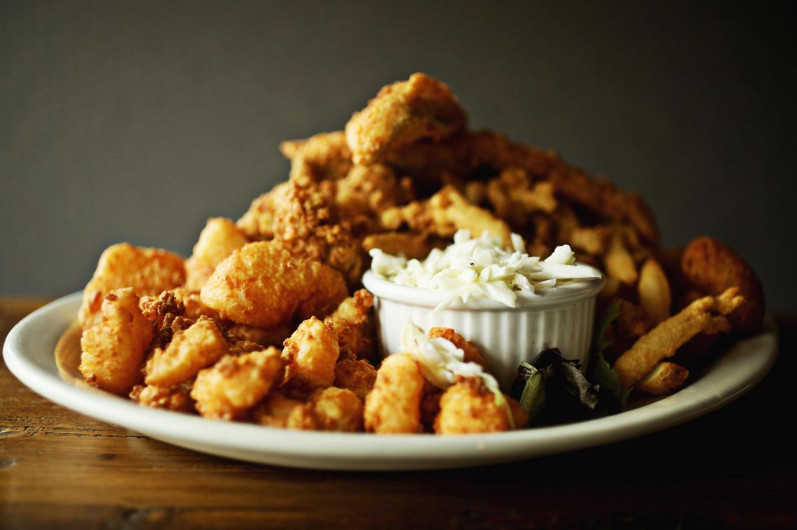 Cape Fear Seafood Company’s the Whole Boat combo was piled generously with fried shrimp, flounder, clams, scallops and oysters, served with fries, hush puppies, and creamy coleslaw.