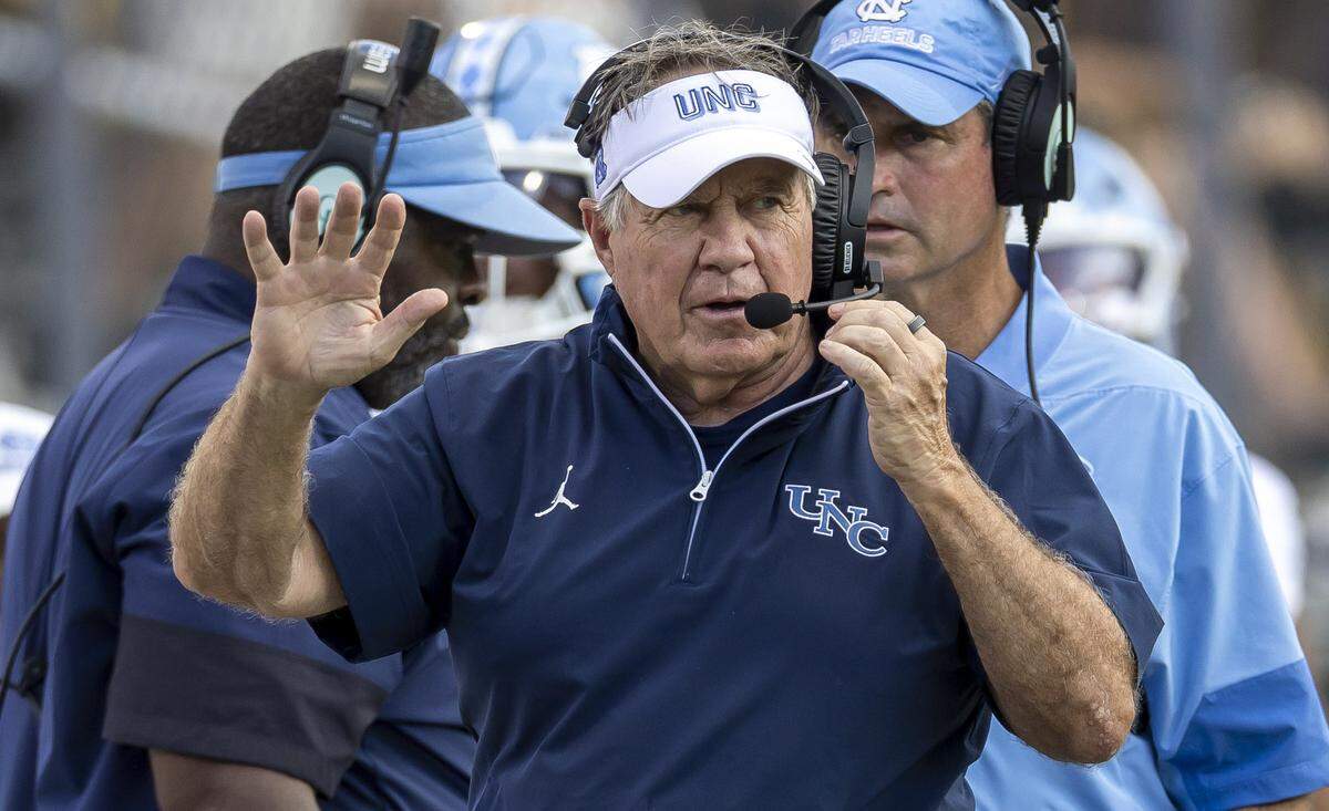 North Carolina coach Bill Belichick signals to his assistant coaches during the third quarter of play against UCF on Saturday, September 20, 2025 at Acrisure Bounce House Stadium in Orlando, Fla.