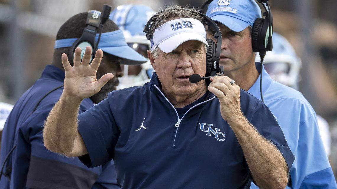 North Carolina coach Bill Belichick signals to his assistant coaches during the third quarter of play against UCF on Saturday, September 20, 2025 at Acrisure Bounce House Stadium in Orlando, Fla.