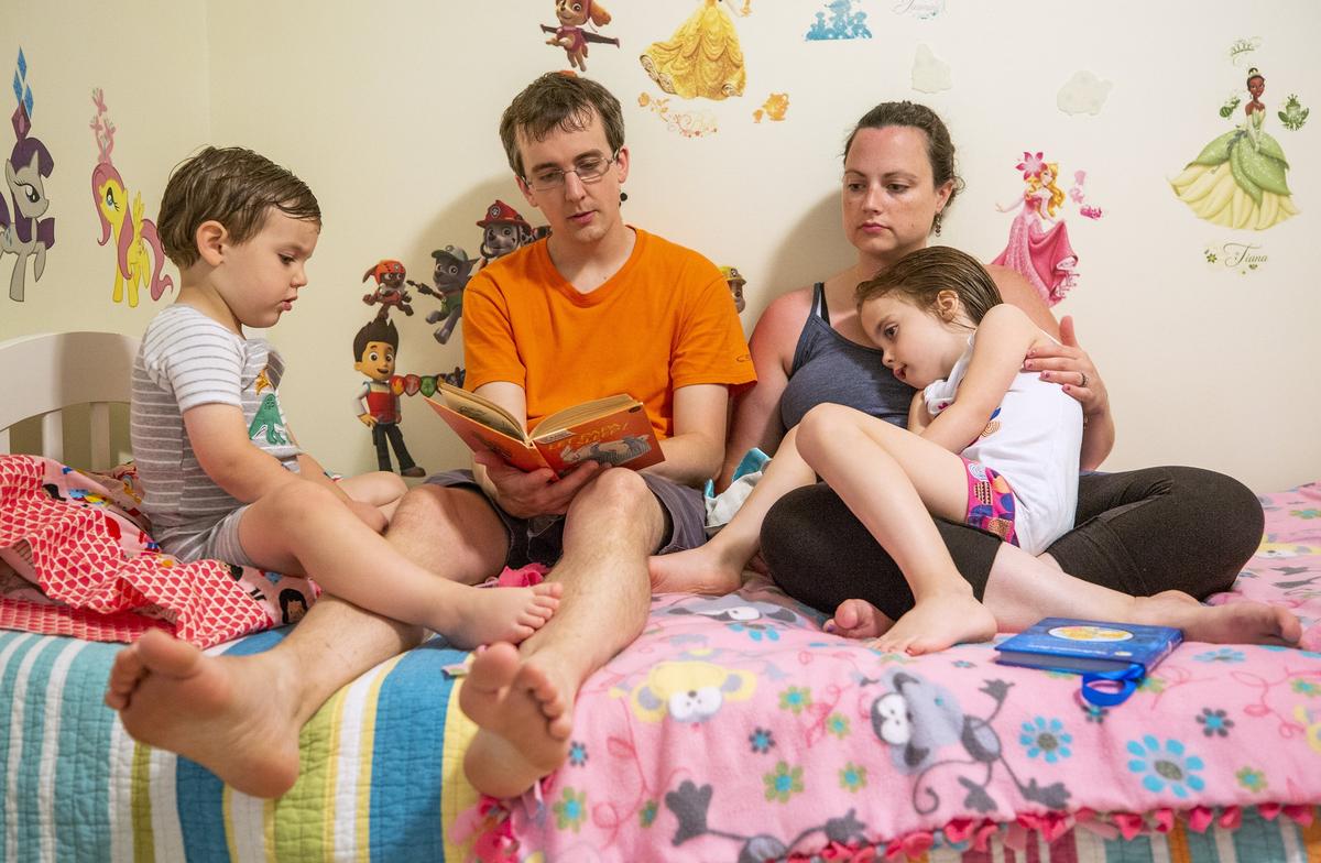 From left, James, Andy, Emily, and Rebekah Neill read a bedtime story together, one of the first few nights without Bekah’s twin sister Avery Neill, who died on Mother’s Day, May 13, 2018, of an incurable brain tumor known as DIPG, on Friday, Jun. 1, 2018, in Raleigh, NC.