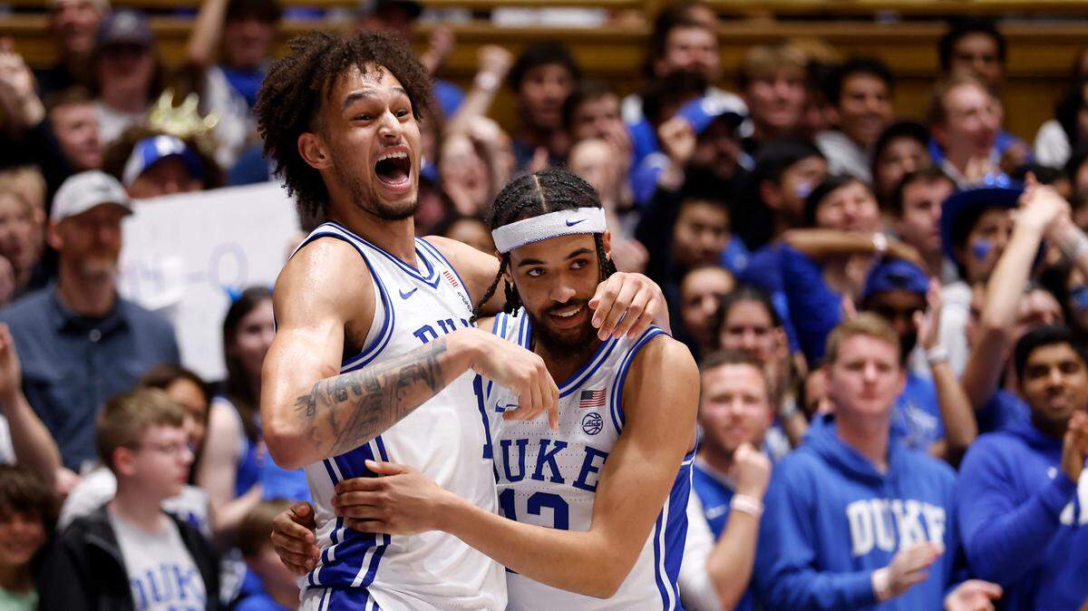 Duke’s Dereck Lively II hugs Jacob Grandison after scoring and being fouled during the second half of the Blue Devils’ 81-65 win over Virginia Tech on Saturday, Feb. 25, 2023, at Cameron Indoor Stadium in Durham, N.C.