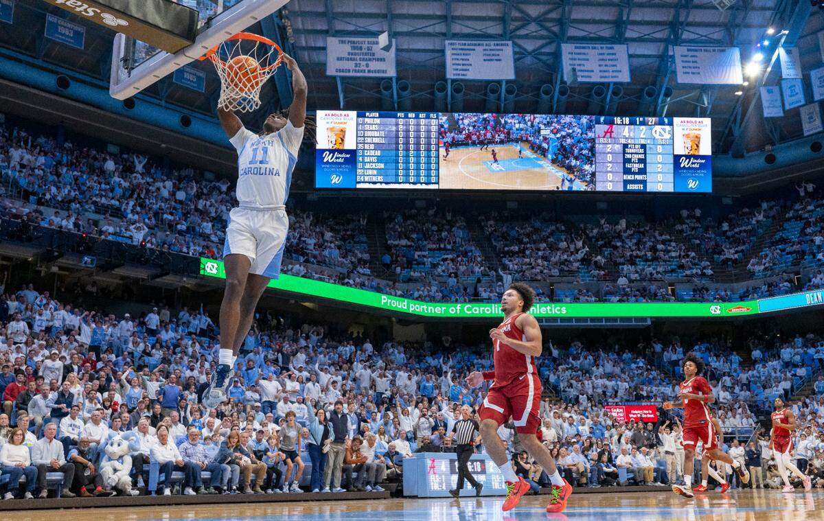 North Carolina guard Ian Jackson (11) breaks to the basket for a dunk on a fast break in the first half against Alabama on Wednesday, December 4, 2024 at the Smith Center in Chapel Hill, N.C.