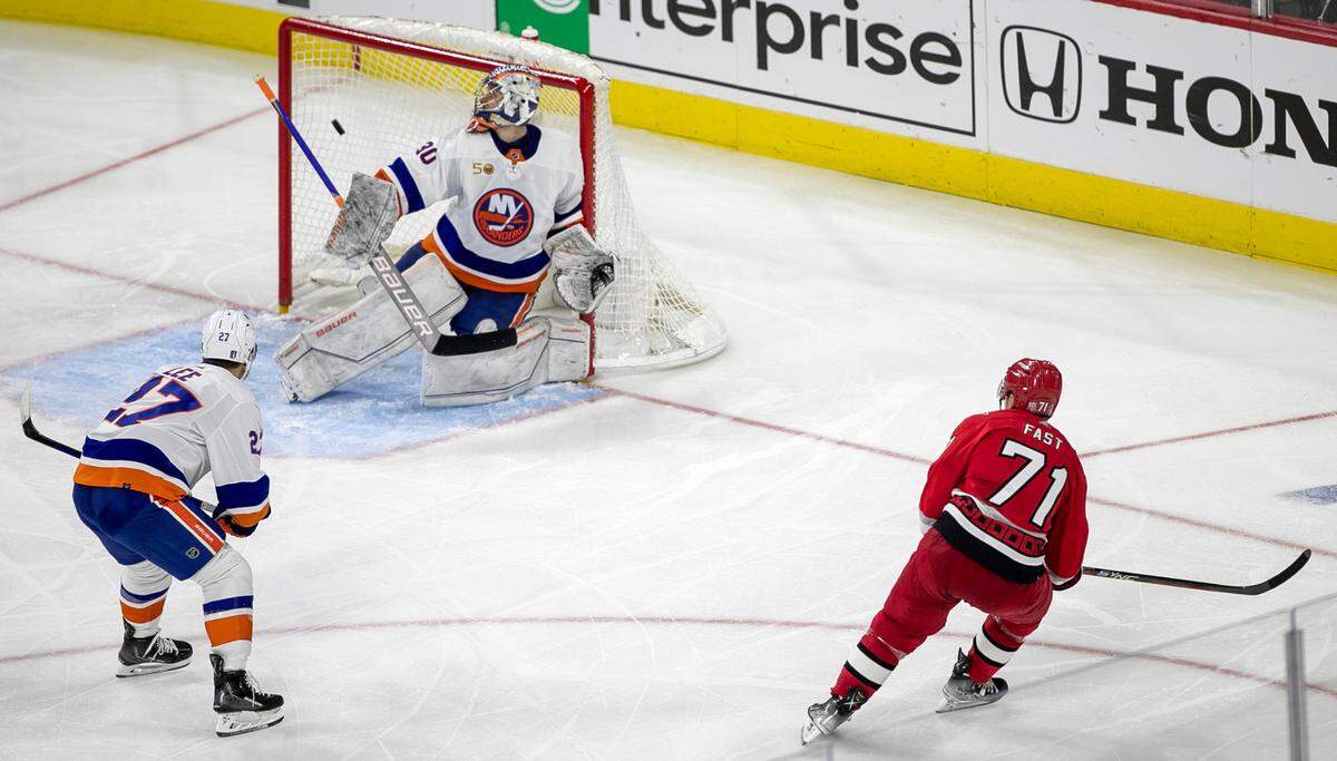 Carolina Hurricanes’ Jesper Fast (71) fires the game winning shot at New York Islander goalie Ilya Sorokin (30) to secure a 4-3 victory in overtime during game two of their Stanley Cup series on Wednesday, April 19, 2023 at PNC Arena in Raleigh, N.C.