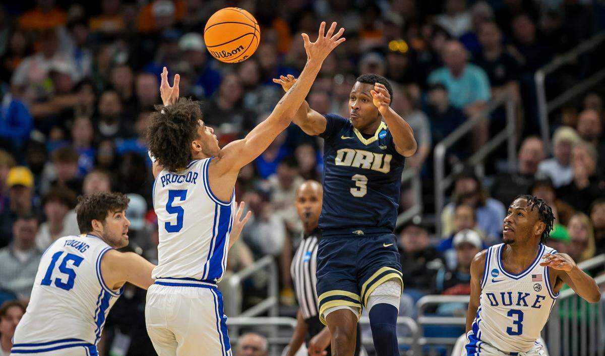 Duke’s Tyrese Proctor (5) defends Oral Roberts’ Max Abmas (3) in the second half during the first round of the NCAA Tournament on Thursday, March 16, 2023 at the Amway Center in Orlando, Fla. The Blue Devils held Abmas to 12 points.