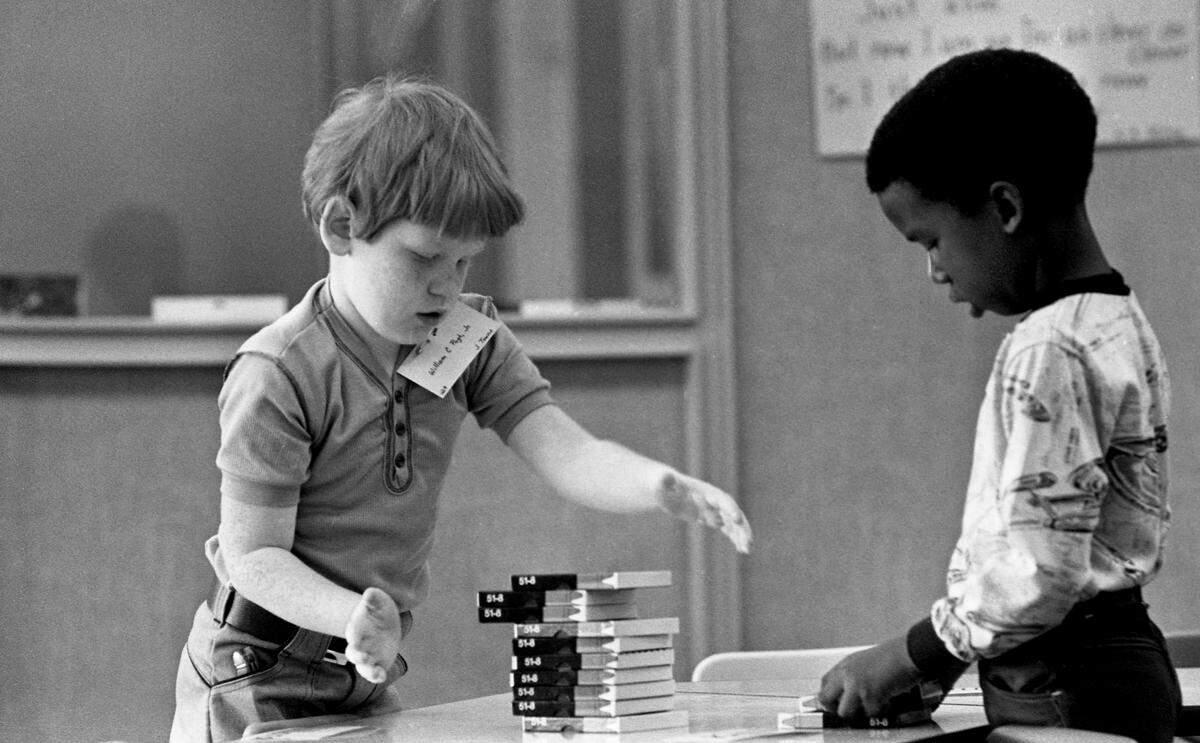 Elementary school students do activities during the first day of school after Raleigh City and Wake County school systems merged in 1976.