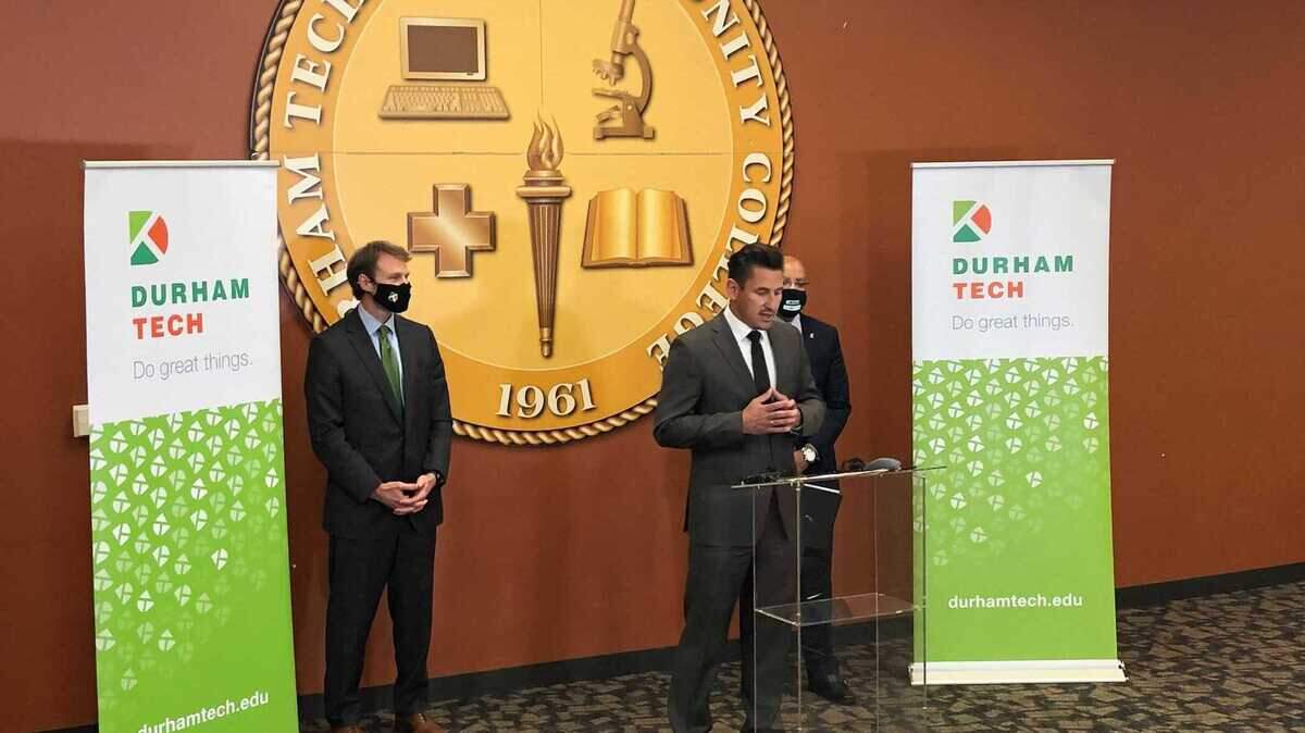 Durham-based KBI BioPharma CEO Dirk Lange announces with Durham Tech president J.B. Buxton and N.C. Community Colleges president Thomas Stith III a new initiative that will offer high school graduates and veterans the opportunity to get job training in the life science and biotech industries.