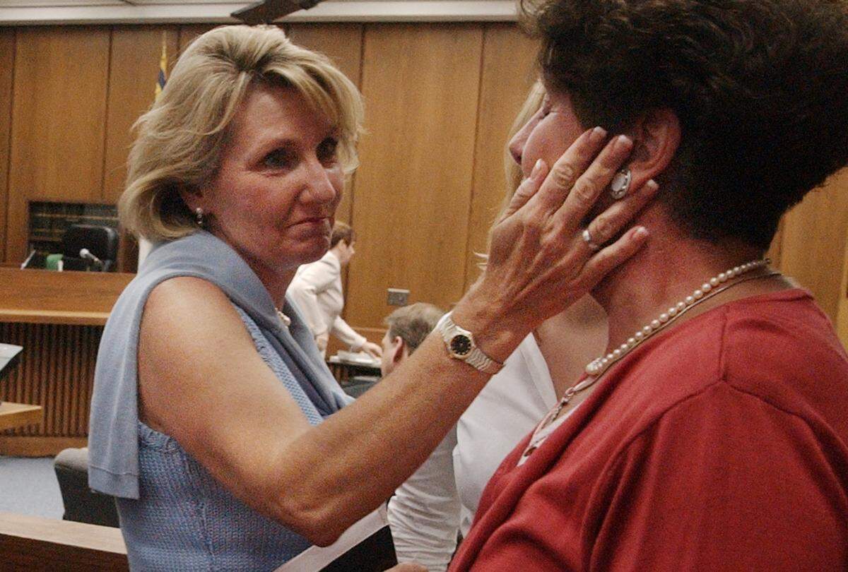 Margaret Blair (at right) is comforted by Candace Zamperini, the sister of Kathleen Peterson, after she testified in the Michael Peterson murder trial Monday. Blair took the stand to talk about her sister Elizabeth Ratliff who died in Germany in 1985. Ratliff’s death was similar to the death of Peterson’s wife Kathleen in December 2001.