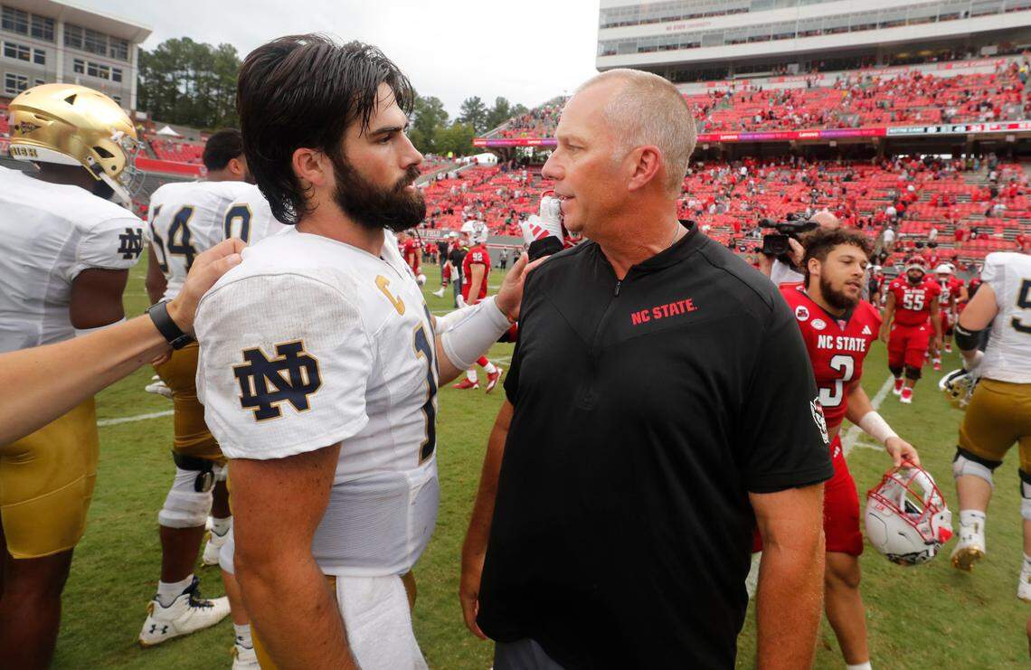 N.C. State head coach Dave Doeren talks with Notre Dame quarterback Sam Hartman (10) after Notre Dame’s 45-24 victory over N.C. State at Carter-Finley Stadium in Raleigh, N.C., Saturday, Sept. 9, 2023.