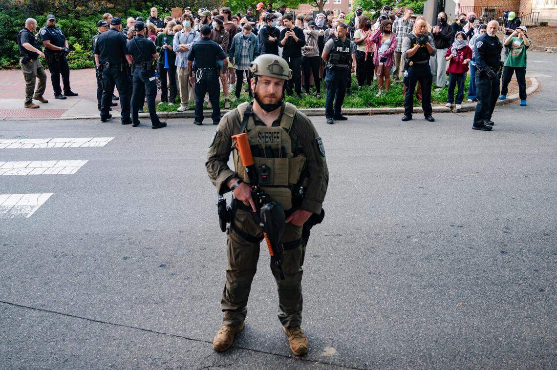 Law enforcement stands surrounds the crowd gathering ouside of Gerrard Hall on UNC Chapel Hill campus on Tuesday, April 30, 2024.