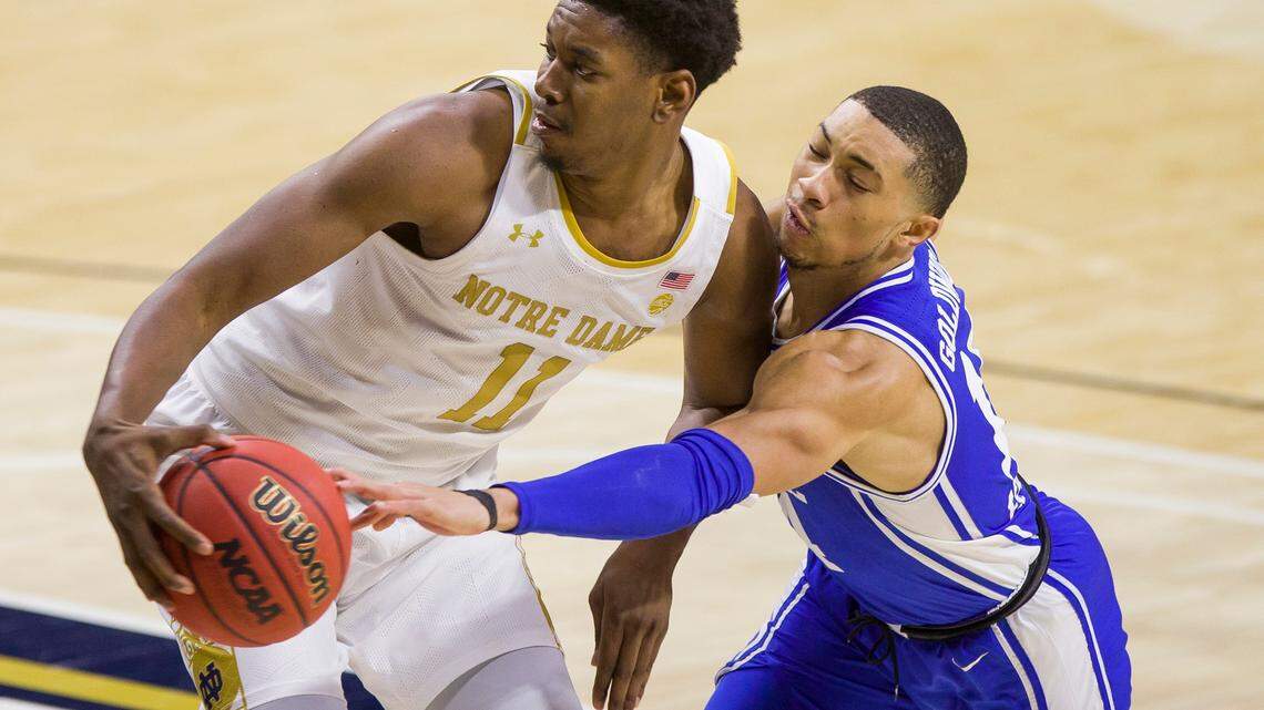 Notre Dame’s Juwan Durham (11) gets pressure from Duke’s Jordan Goldwire during the second half of an NCAA college basketball game Wednesday, Dec. 16, 2020, in South Bend, Ind. Duke won 75-65.