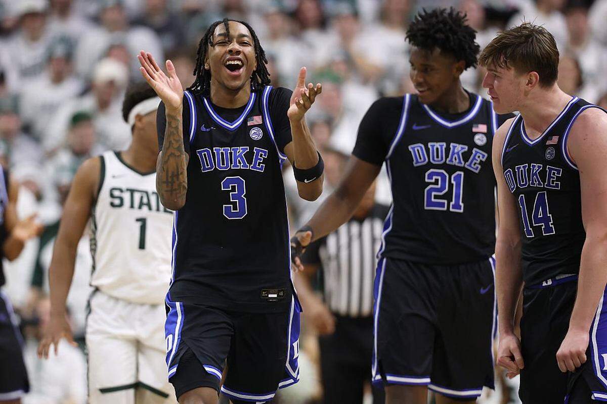 EAST LANSING, MICHIGAN - DECEMBER 06: Isaiah Evans #3 and Nikolas Khamenia #14 of the Duke Blue Devils celebrate a 66-60 win over the Michigan State Spartans at Breslin Center on December 06, 2025 in East Lansing, Michigan. (Photo by Gregory Shamus/Getty Images)