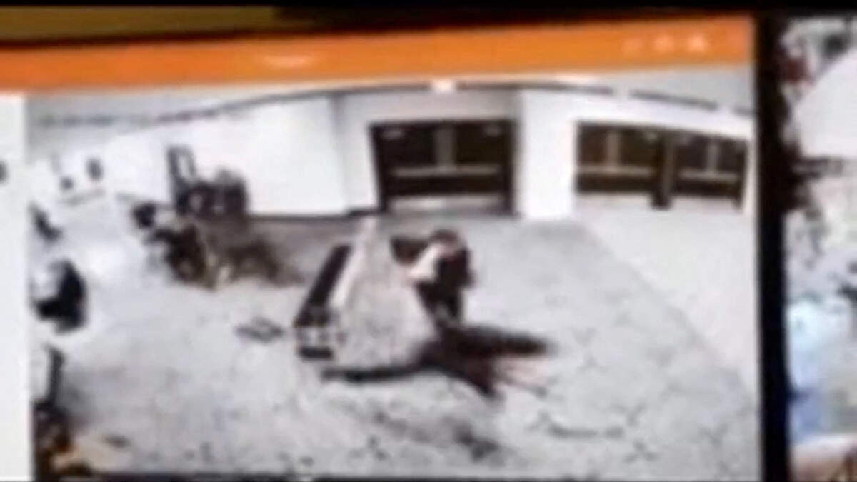 Law enforcement personnel react as a man armed with a shotgun tries to breach security at the venue of the White House Correspondents' Association dinner, in Washington, D.C., U.S. April 25, 2026, in this screengrab from a CCTV footage.