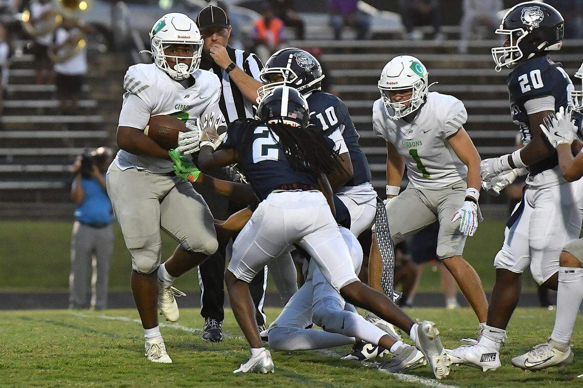 Cardinal Gibbons running back Noah Terry (8) scores the touchdown against the Southeast Raleigh defense during the first half. The Southeast Raleigh Bulldogs and the Cardinal Gibbons Crusaders met in a non-conference football game in Raleigh, N.C. September 12, 2025