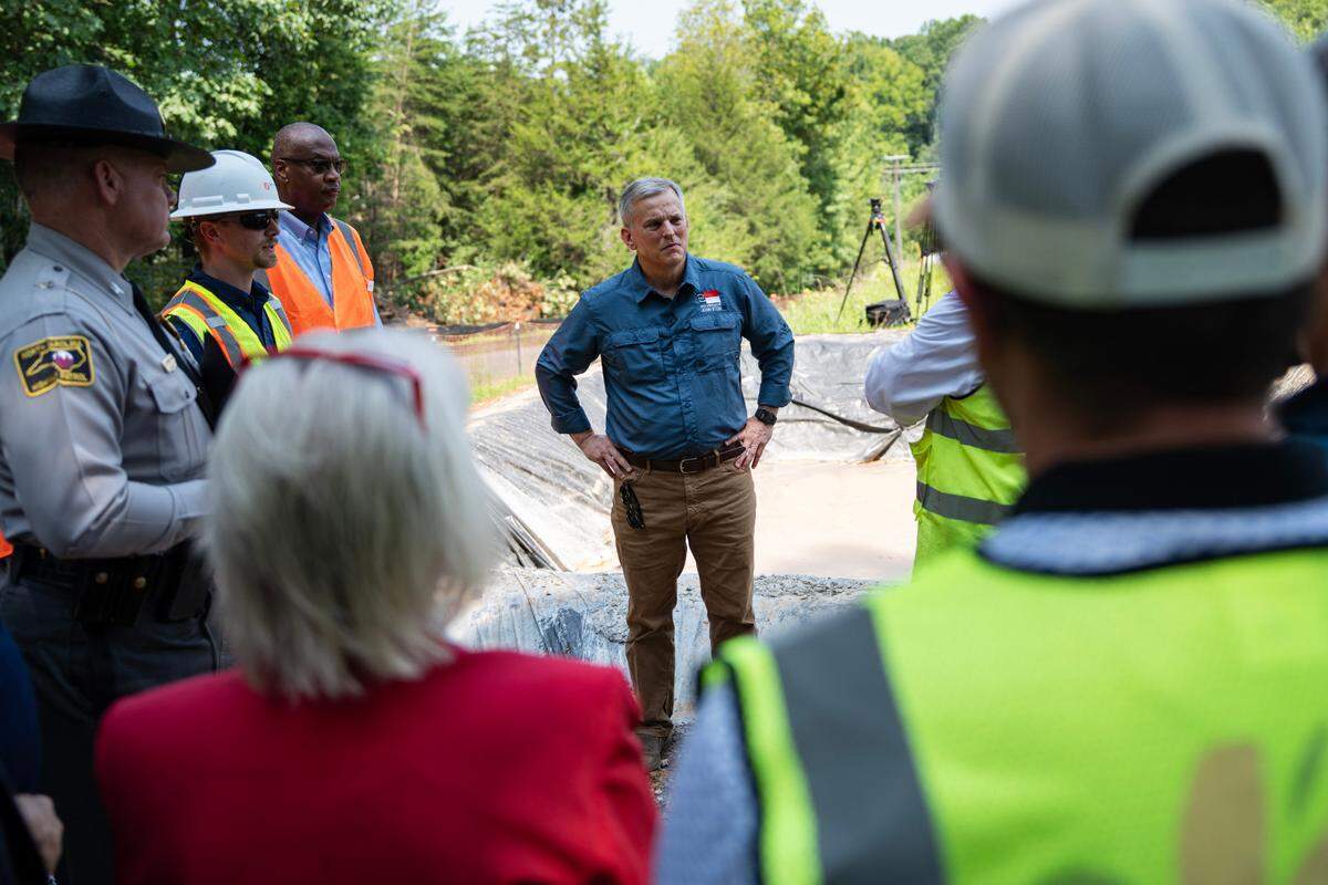 N.C. Governor Josh Stein speaks to press and city officials in Mebane, N.C. on Tuesday, July 8, following Tropical Storm Chantal on Sunday, July 6, 2025. High water levels on Lake Michael in Mebane led to evacuations of residents downstream.