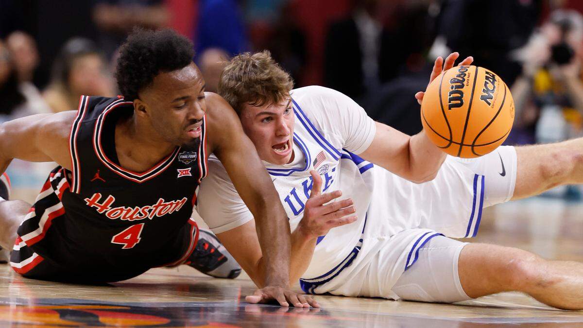 Duke’s Cooper Flagg battles with Houston’s L.J. Cryer in first half action at the Final Four.