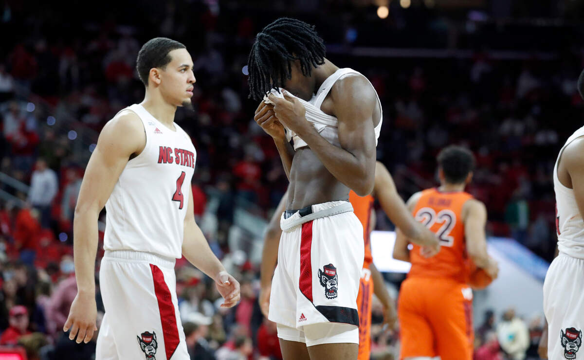 N.C. State’s Dereon Seabron (1) reacts as time runs out in Virginia Tech’s 62-59 victory over N.C. State at PNC Arena in Raleigh, N.C., Wednesday, Jan. 19, 2022. N.C. State’s Jericole Hellems (4) is to the left.