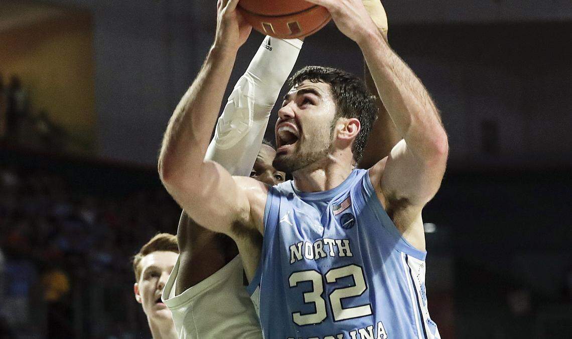North Carolina forward Luke Maye rebounds the ball against Miami during the first half of an NCAA college basketball game on Saturday, Jan. 19, 2019, in Coral Gables, Fla.