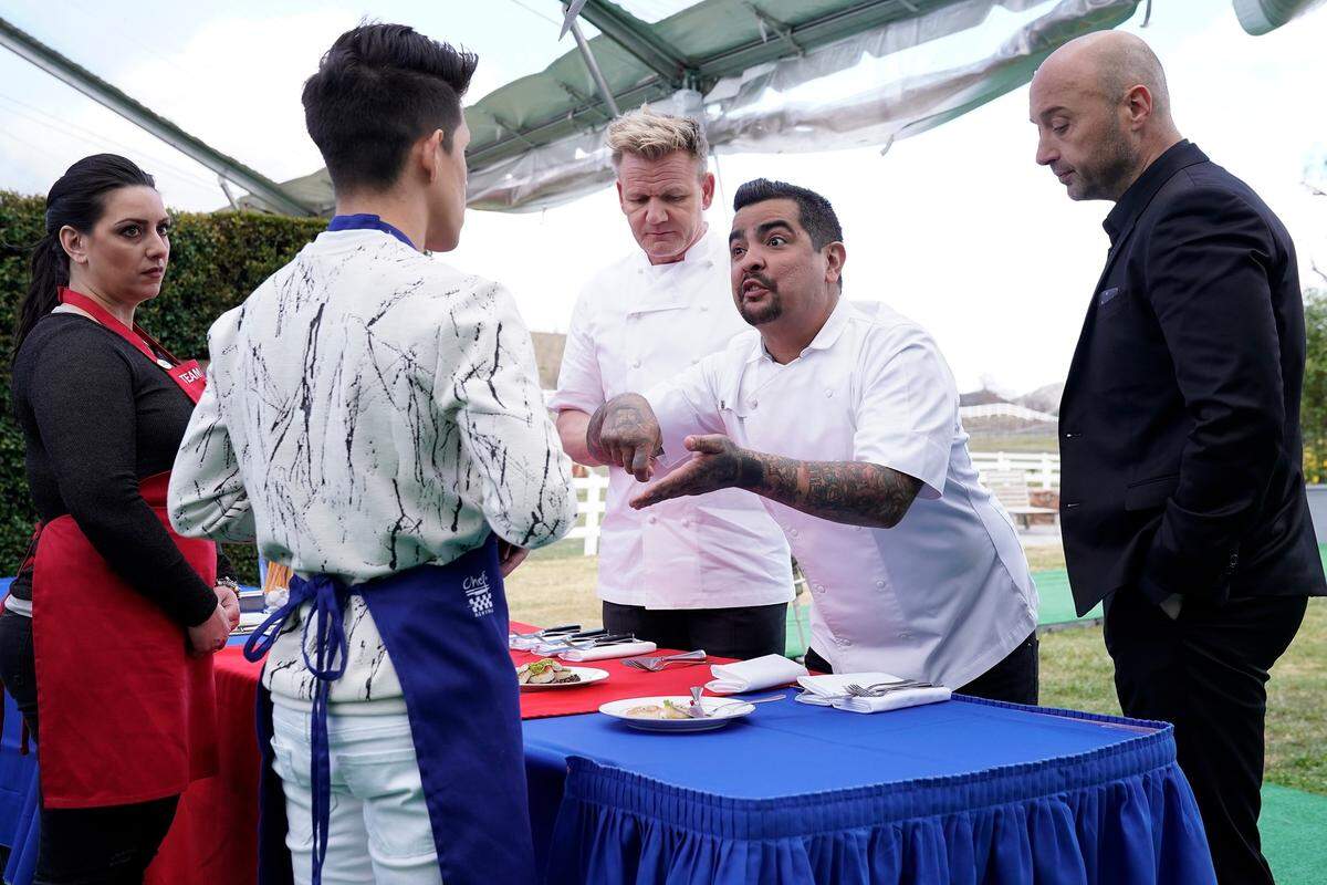Judge Aaron Sanchez (center, across table) fusses at Juni Cuevas in the "A Gordon Ramsay Wedding" episode of "MasterChef" airing Wednesday, July 11 on Fox.
