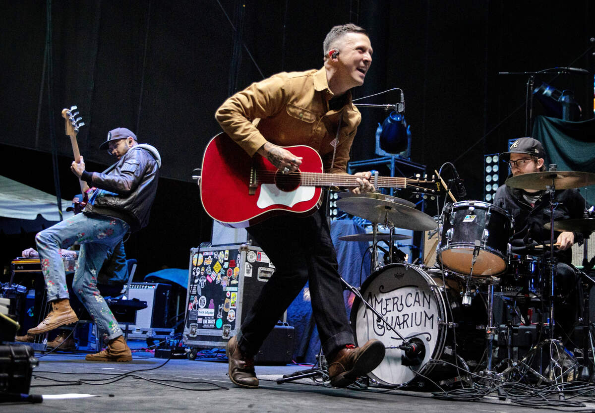 American Aquarium’s BJ Barham (center), bass player Bill Corbin (left) and drummer Kevin McClain in action on stage at Band Together Mighty Giveback concert, Friday night, Oct. 28, 2022.
