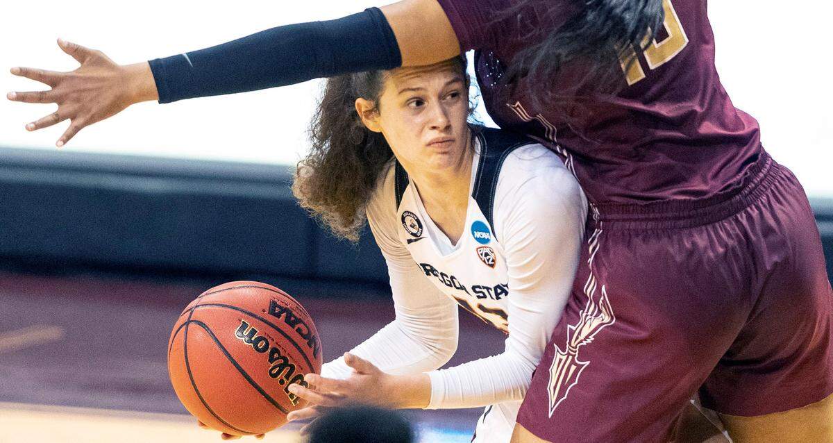 Oregon State’s Sasha Goforth, left, passes around Florida State guard Kourtney Weber during the first half of a college basketball game in the first round of the women’s NCAA tournament at the University Events Center in San Marcos, Texas, Sunday, March 21, 2021. 