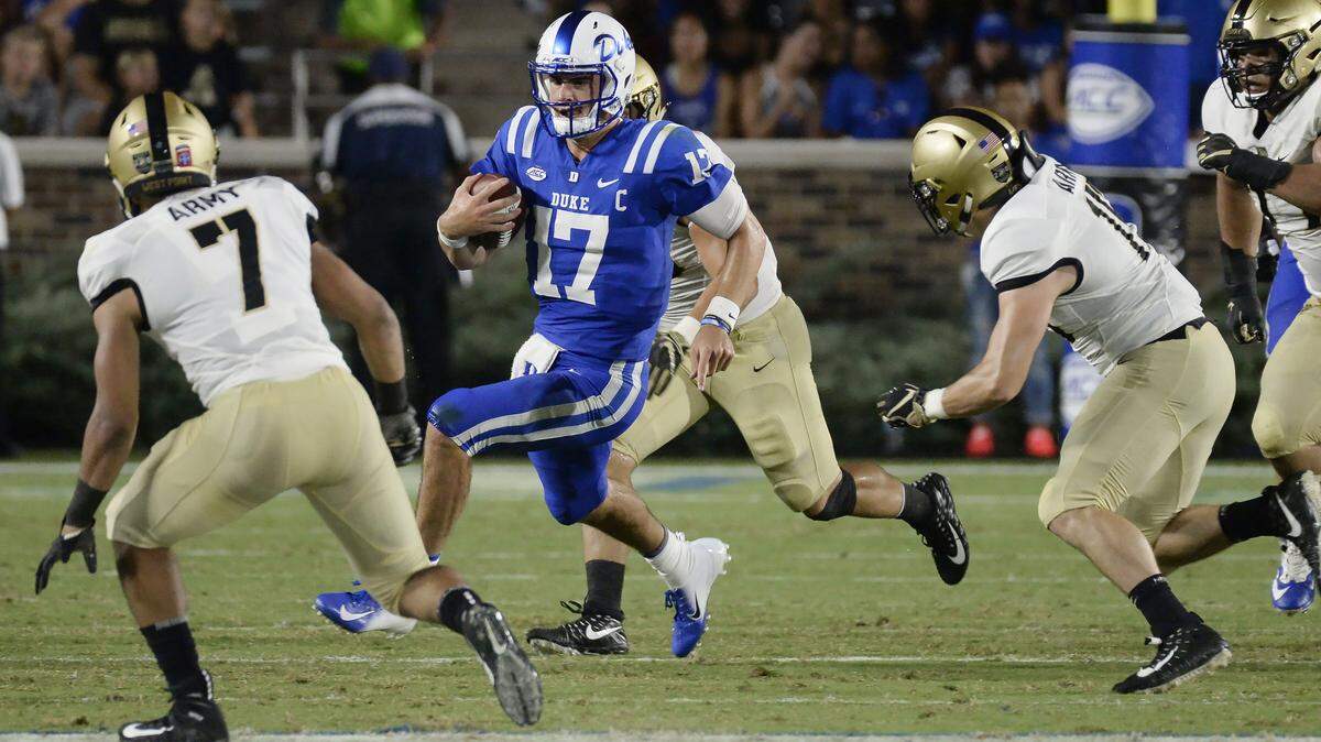 Duke quarterback Daniel Jones (17) looks for running room against the Army defense in the first quarter of play. Duke opened the 2018 football season against Army at Wallace Wade Stadium in Durham, N.C., Friday, August 31, 2018.