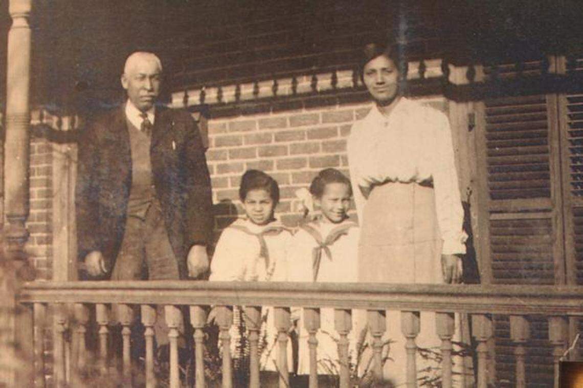 A family portrait of Manassa Pope and his wife, Delia, and daughters Ruth and Evelyn. The photo is part of an exhibit at the City of Raleigh Museum.