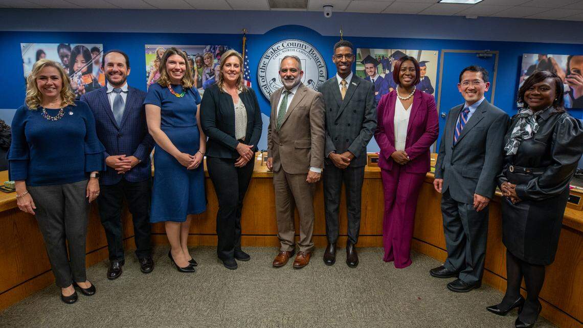 Wake County school board members Lynn Edmonds, Sam Hershey, Lindsay Mahaffey, Cheryl Caulfield, Chris Heagarty, Tyler Swanson, Tara Waters, Dr. Wing Ng and Monika Johnson-Hostler take a group photo after being sworn into office on Dec. 6. 2022.