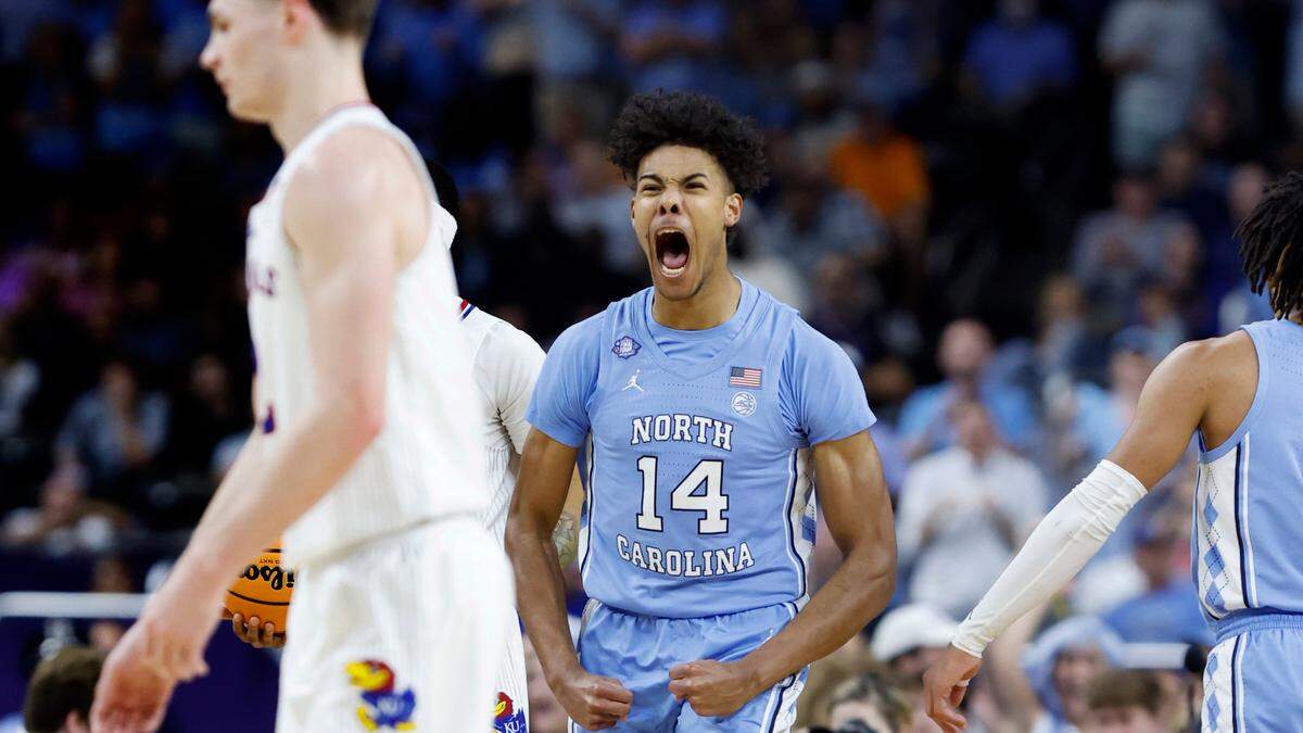 North Carolina’s Puff Johnson (14) celebrates after Kansas turned the ball over during the first half of UNCís game against Kansas in the NCAA Menís National Championship at the Caesars Superdome in New Orleans, La., Monday, April 4, 2022.