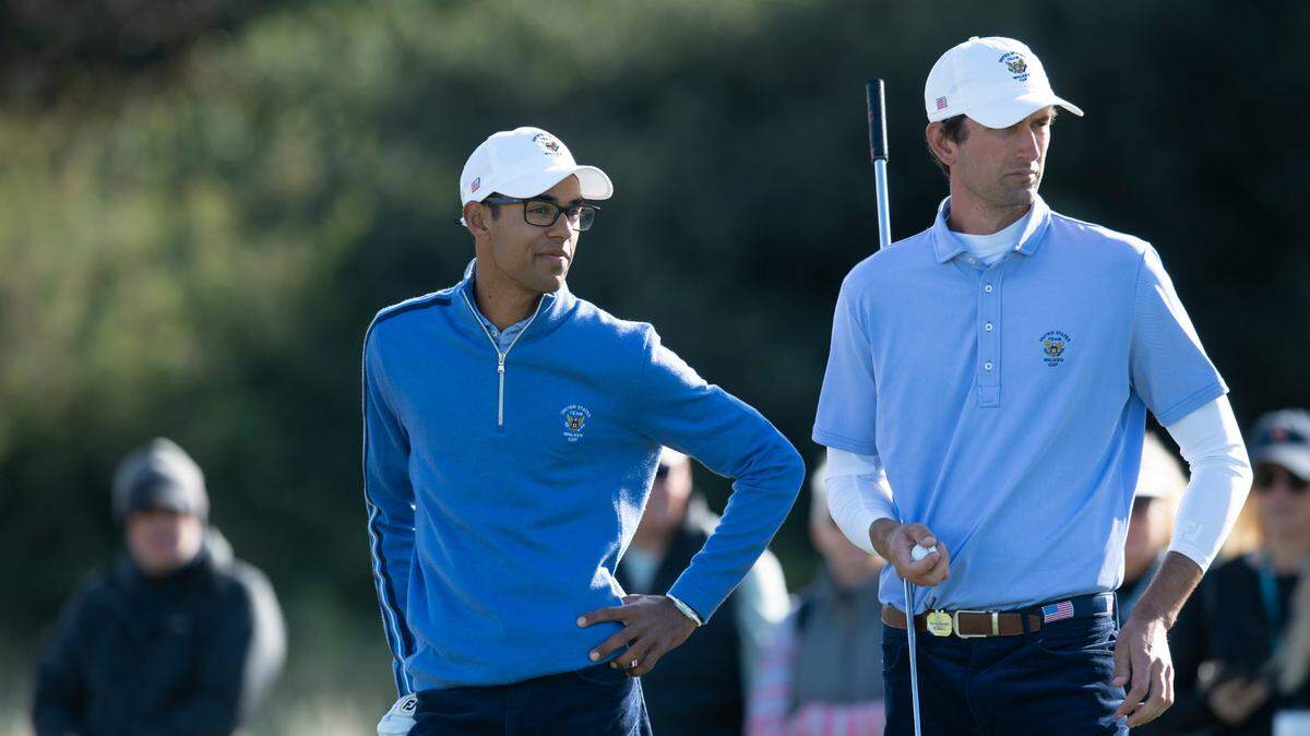 Akshay Bhatia of the USA team, left, smiles as he stands alongside teammate Stewart Hagestad during the Day 2 Foursomes at the Walker Cup golf trophy between the United States and the Great Britain and Ireland team at Royal Liverpool Golf Club in Hoylake, England, Sunday, Sept. 8, 2019.