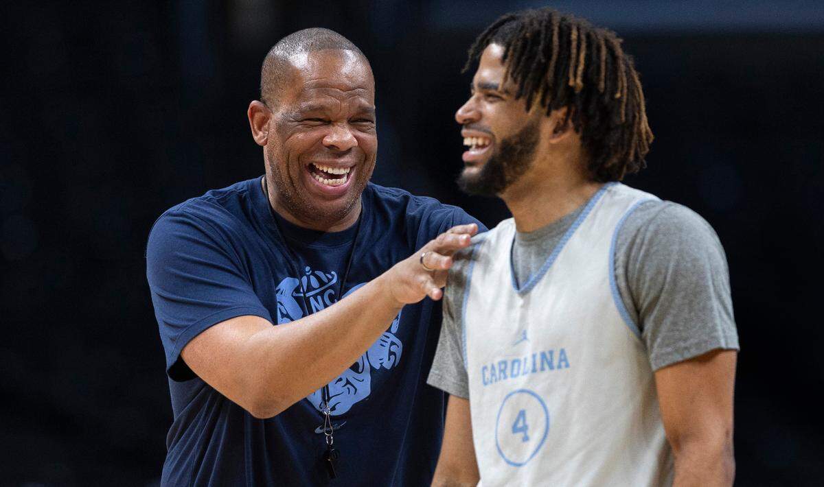 North Carolina coach Hubert Davis laughs with R.J. Davis (4) during the Tar Heels’ practice on Wednesday, March 27, 2024 at Crypto.com Arena in Los Angeles, CA. North Carolina will face Alabama in the NCAA Sweet Sixteen on Thursday.