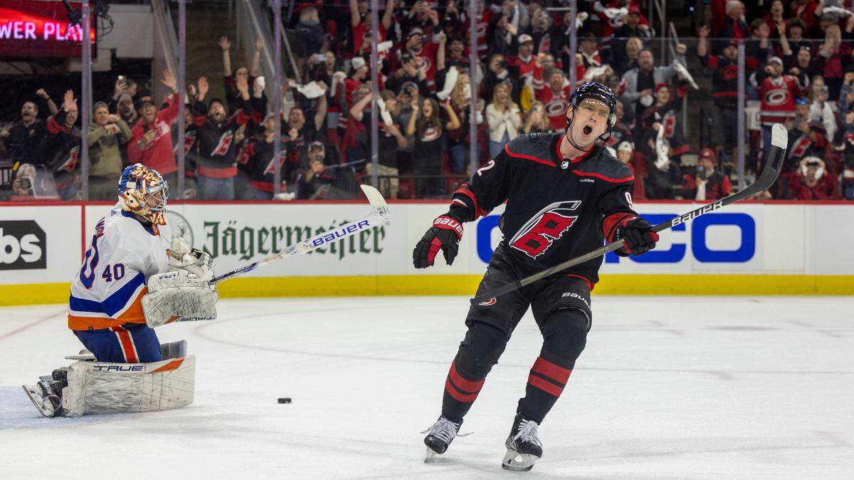 Carolina Hurricanes center Evgeny Kuznetsov (92) reacts after scoring on a penalty shot against New York Islander goalie Semyon Varlamov (40) in the first period during Game 5 of the NHL Eastern Conference quarterfinals agains the New York Islanders on Tuesday, April 30, 2024 at PNC Arena, in Raleigh N.C.