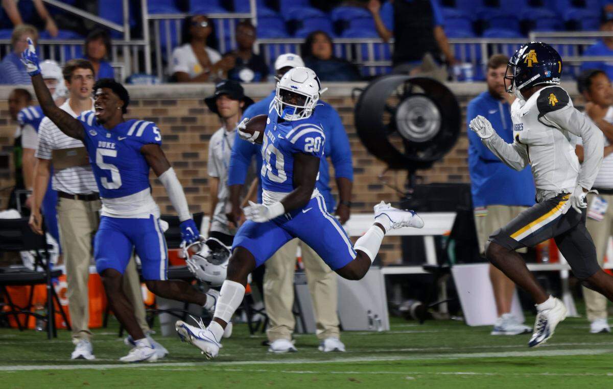 Duke Blue Devils running back Jaquez Moore breaks away from the defense of North Carolina A&T Aggies linebacker Tyquan King during the second half of Dukes game against North Carolina A&T at Wallace Wade Stadium in Durham, N.C. on Saturday, Sept. 17, 2022.
