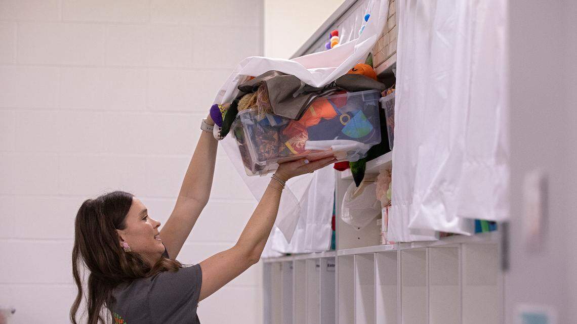 Emily Brugler, a first-year pre-kindergarten teacher, prepares her classroom at South Lakes Elementary School on Thursday, Aug. 22, 2024, in Fuquay-Varina, N.C.