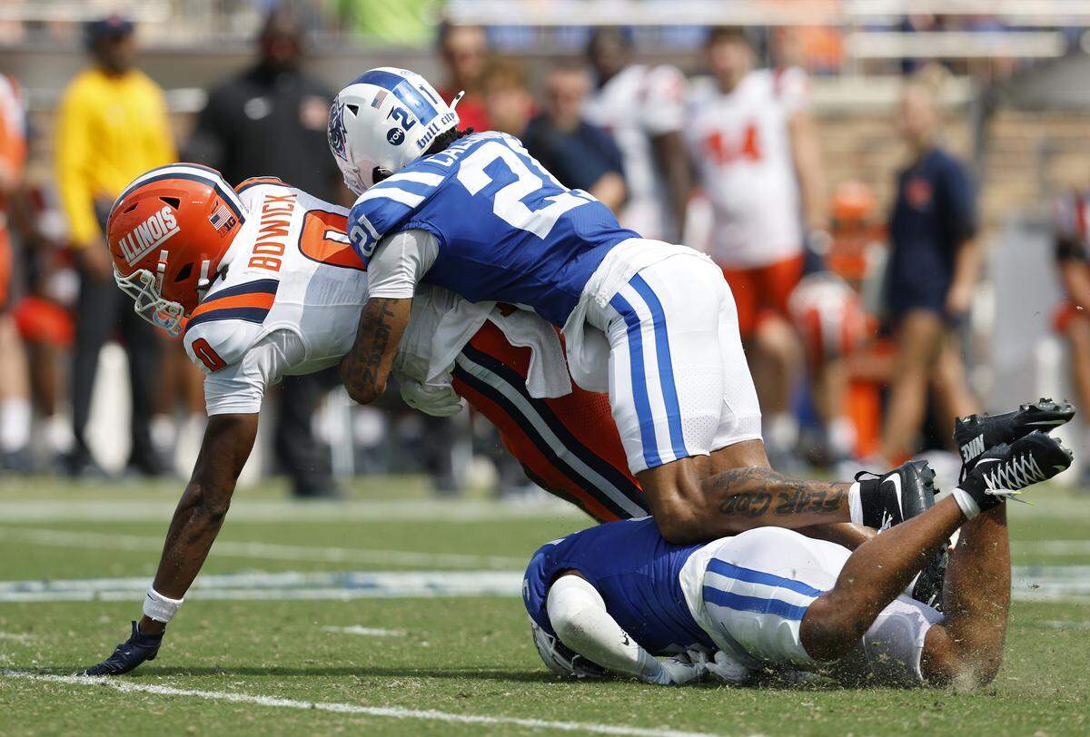 Duke’s Landan Callahan and Caleb Weaver tackle Illinois’ Justin Bowick at Wallace Wade Stadium on Sept. 6. 