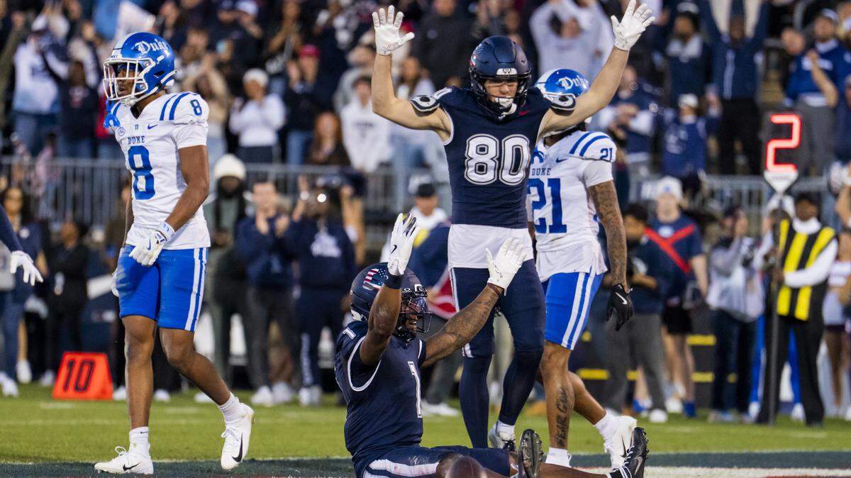 EAST HARTFORD, CONNECTICUT - NOVEMBER 08: Skyler Bell #1 of the Connecticut Huskies celebrates after scoring a touchdown against the Duke Blue Devils during the first half of an NCAA football game at Rentschler Field on November 08, 2025 in East Hartford, Connecticut. (Photo by Joe Buglewicz/Getty Images)