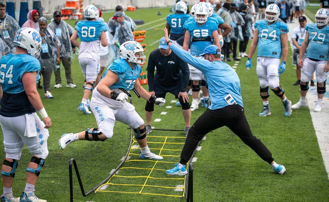 North Carolina offensive lineman Eli Sutton (73) runs thought a drill with fellow linemen during the Tar Heels’ open practice on Saturday, March 25, 2023 at Kenan Stadium in Chapel Hill. N.C.