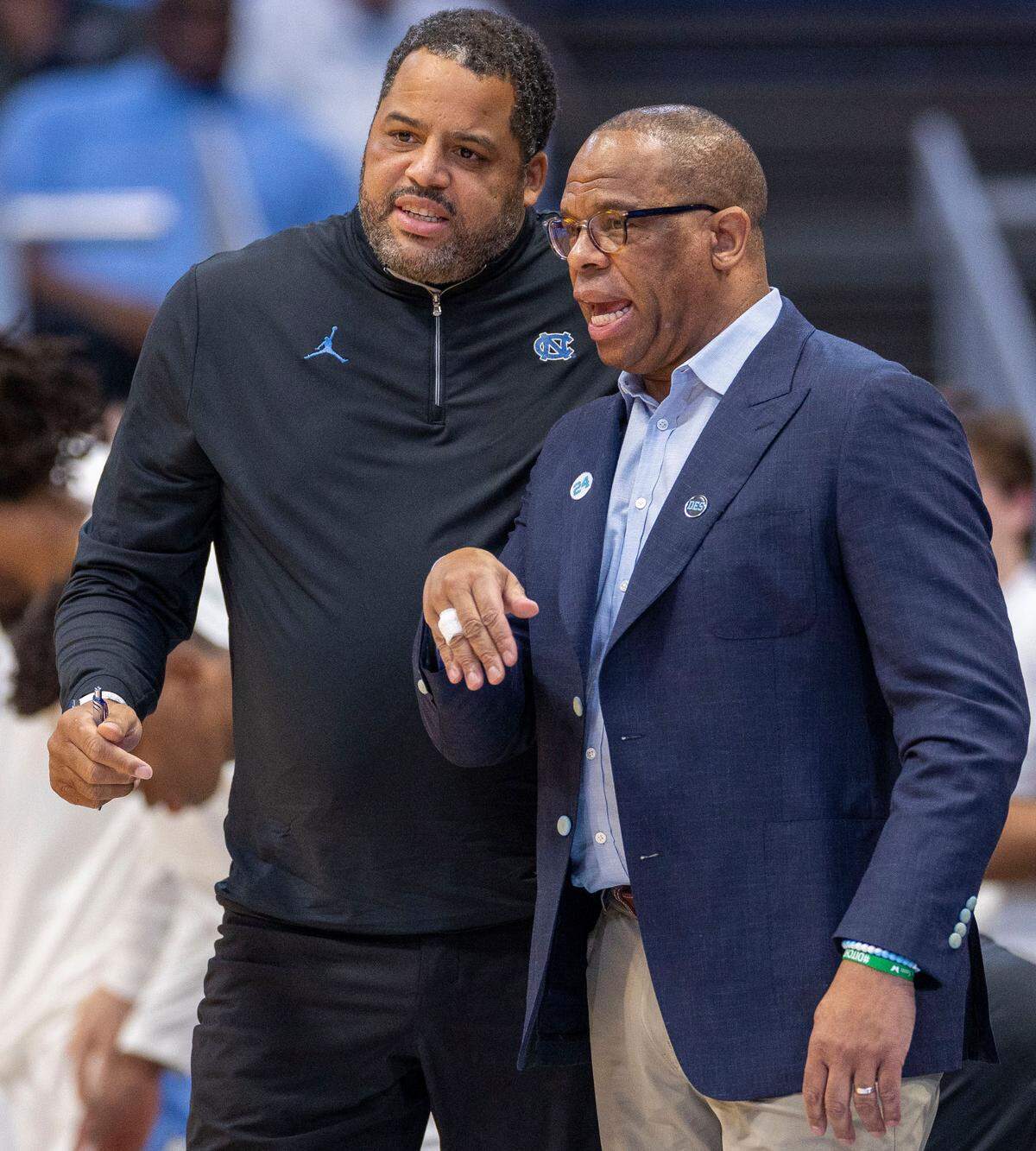North Carolina coach Hubert Davis confers with assistant coach Sean May in the first half against SMU on Tuesday, January 7, 2025 in Chapel Hill, N.C.