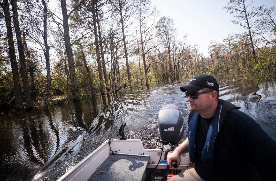 Matt Butler, a program director for Sound Rivers, takes News and Observer journalists to view the damage done to Sutton Lake as a result of Hurricane Florence on Saturday, Sept. 22, 2018. 