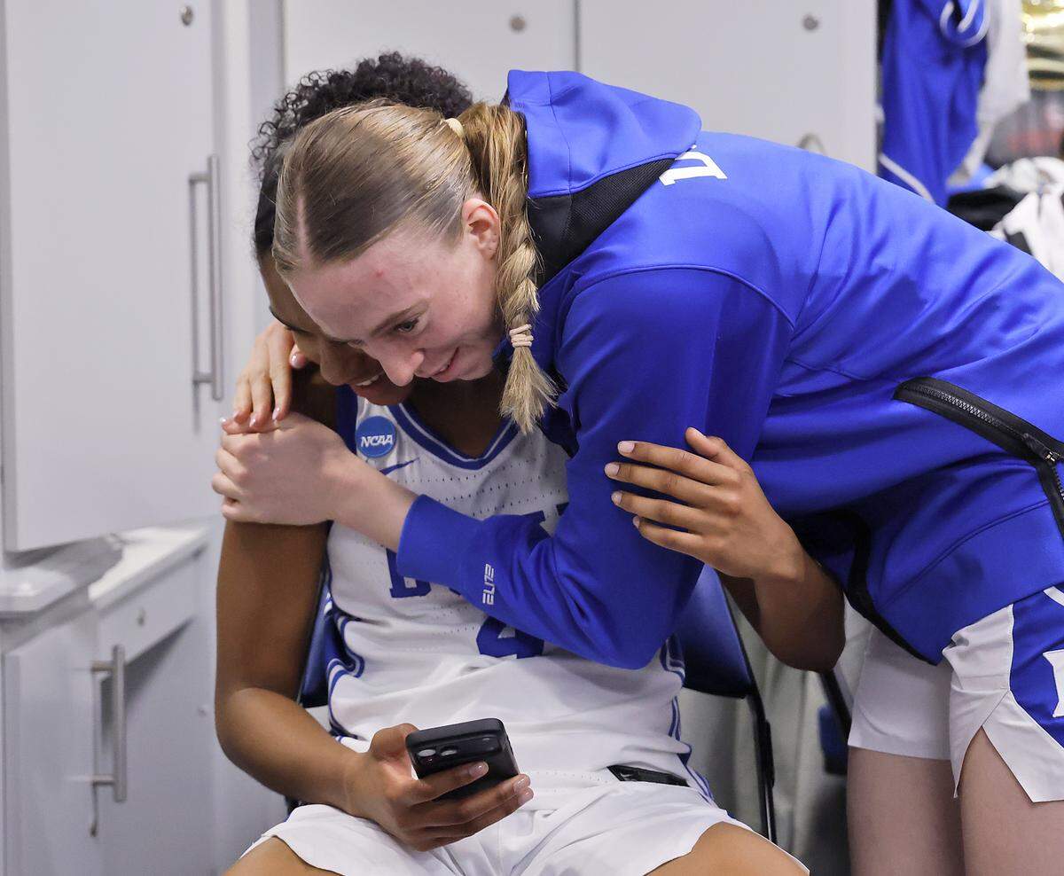 Duke’s Toby Fournier, left, hugs teammates Riley Nelson in the locker room following the Blue Devils’ 81-64 first-round NCAA Tournament win over College of Charleston on Friday, March 20, 2026, at Cameron Indoor Stadium in Durham, N.C.