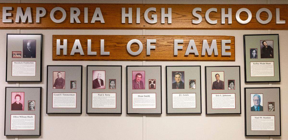 North Carolina coach Dean Smith is enshrined in the Emporia High School Hall of Fame. His photo and bio, center, are shown on Wednesday, November 6, 2024 in Emporia, Kansas. Visitors to the school must pass the display when entering the building.  