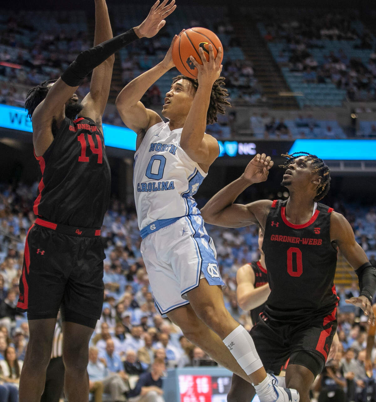 North Carolina’s Seth Trimble (0) drives against Gardner-Webb’s Kareem Reid (14) during the first half on Tuesday, November 15, 2022 at the Smith Center in Chapel Hill, N.C.