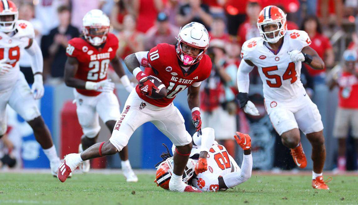 N.C. State wide receiver KC Concepcion (10) breaks free from Clemson cornerback Toriano Pride Jr. (23) on his way to score on a 72-yard touchdown reception during the second half of N.C. State’s 24-17 victory over Clemson at Carter-Finley Stadium in Raleigh, N.C., Saturday, Oct. 28, 2023.