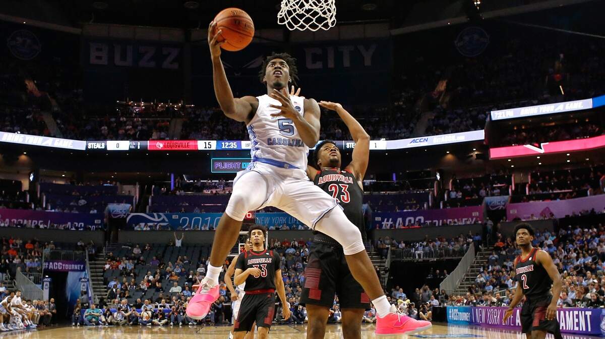 North Carolina’s Nassir Little (5) drives to the basket past Louisville’s Steven Enoch (23) during UNC’s 83-70 victory over Louisville in the quarterfinals of the 2019 ACC Tournament in Charlotte, N.C., Thursday, March 14, 2019.