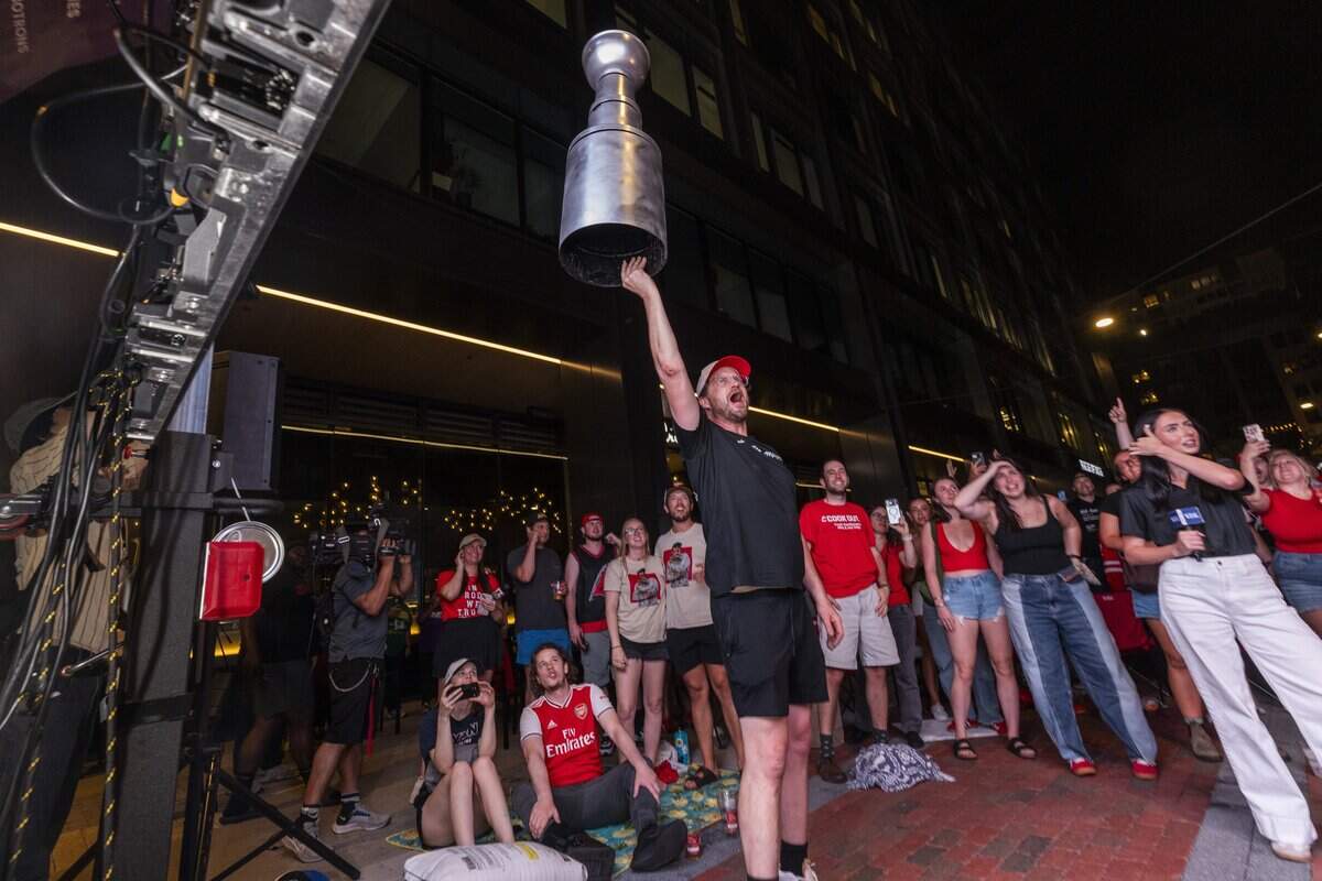 Carolina Hurricanes fans celebrate the team's Stanley Cup victory over the Vegas Golden Knights in Las Vegas in Raleigh's Smoky Hollow district on Sunday, June 14, 2026. The Hurricanes last won the Stanley Cup in 2006.