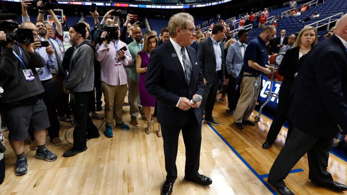 ACC commissioner John Swofford gets ready to to announce the ACC basketball tournament has been canceled amid rapidly increasing concerns about the spread of COVID-19, the coronavirus disease at the Greensboro Coliseum Thursday, March 12, 2020.